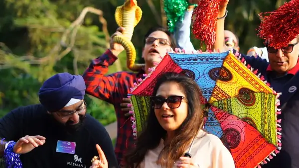 Team members showcasing creativity in the Showtime activity at The Thought Bulb.